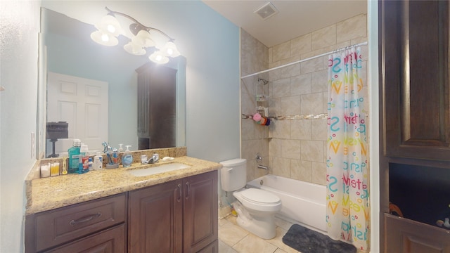 full bathroom with shower / tub combo with curtain, tile flooring, toilet, and vanity with extensive cabinet space