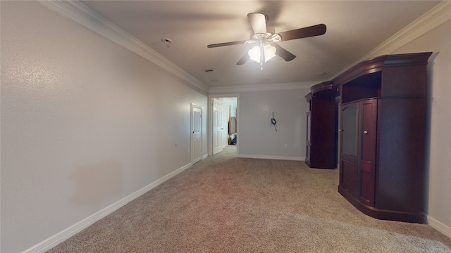 interior space with ornamental molding and ceiling fan