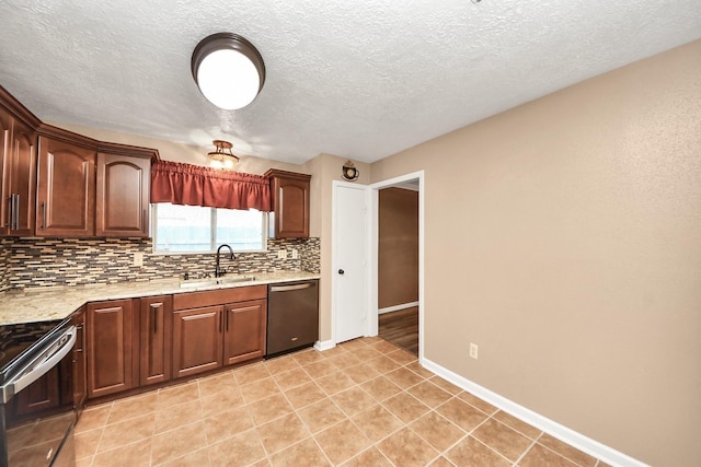 kitchen featuring sink, light tile patterned floors, a textured ceiling, appliances with stainless steel finishes, and tasteful backsplash