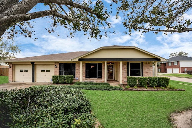 single story home with a garage and a front yard