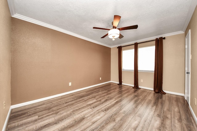 unfurnished room featuring hardwood / wood-style floors, a textured ceiling, and ornamental molding