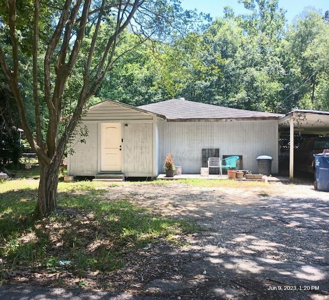 715 S 14th St, Silsbee, TX 77656 - view of front of house featuring a carport