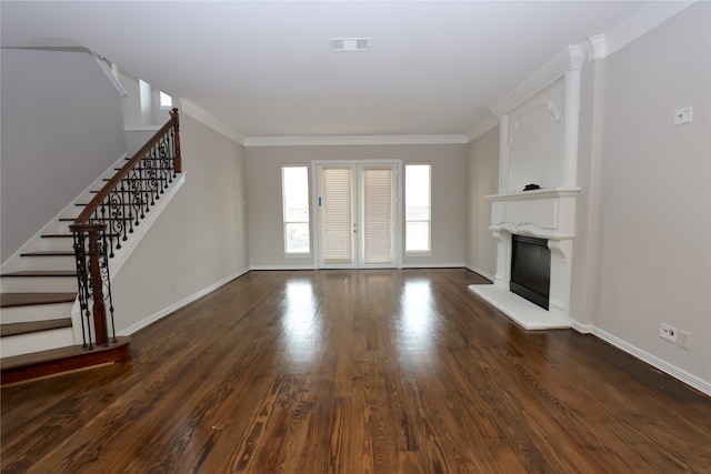 unfurnished living room with dark wood-type flooring and crown molding