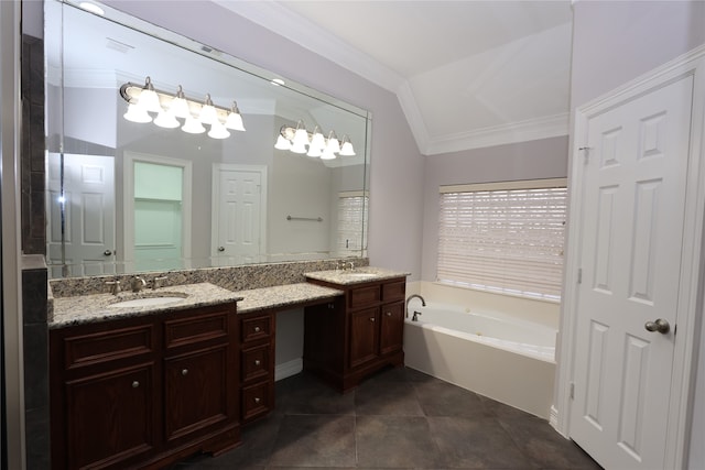 bathroom featuring dual vanity, tile patterned floors, crown molding, and a bathtub