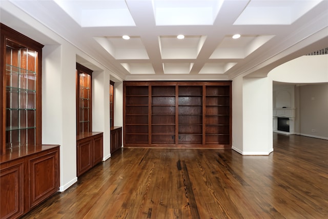 interior space with a skylight, dark hardwood / wood-style floors, and coffered ceiling