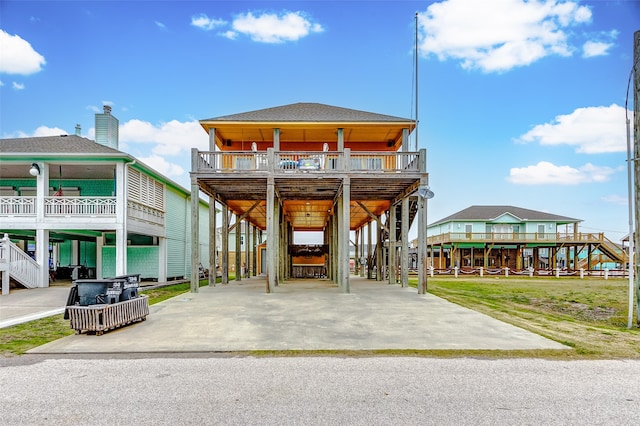 view of front of house featuring a balcony