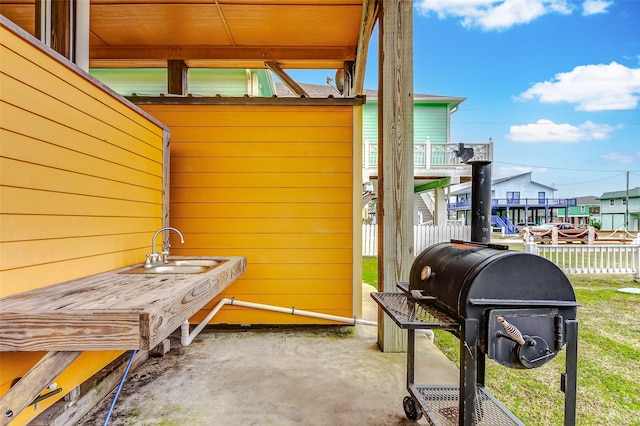 view of terrace featuring area for grilling and sink