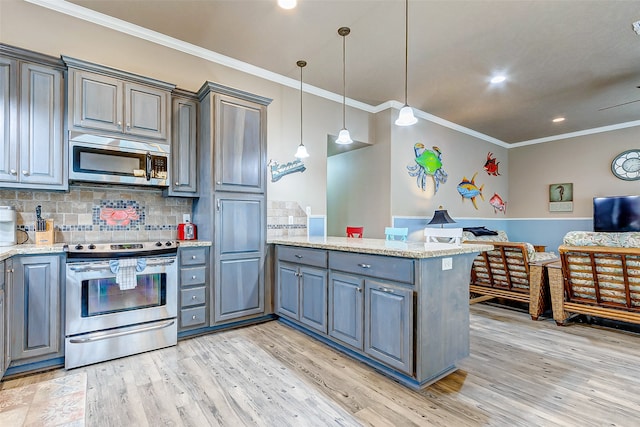 kitchen featuring decorative light fixtures, light hardwood / wood-style floors, tasteful backsplash, and stainless steel appliances