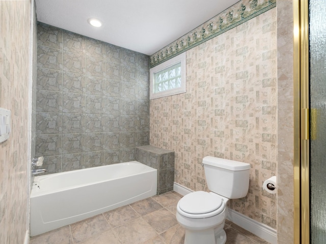 bathroom with tiled shower / bath combo, toilet, and tile flooring