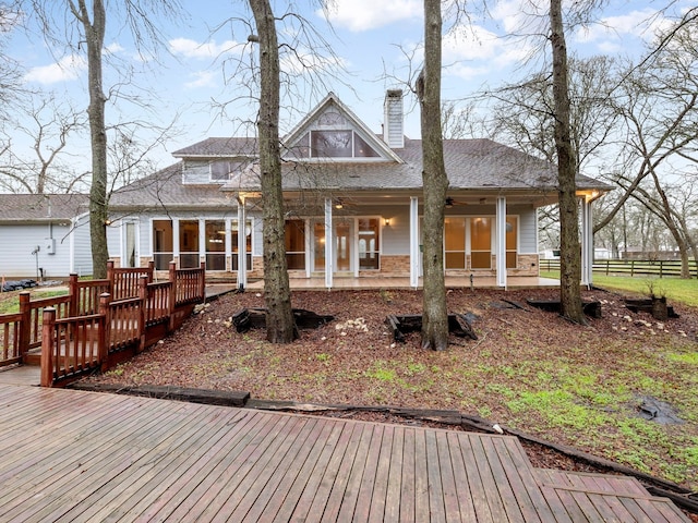 back of house featuring a wooden deck