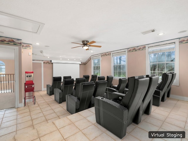 cinema room featuring ceiling fan and light tile floors