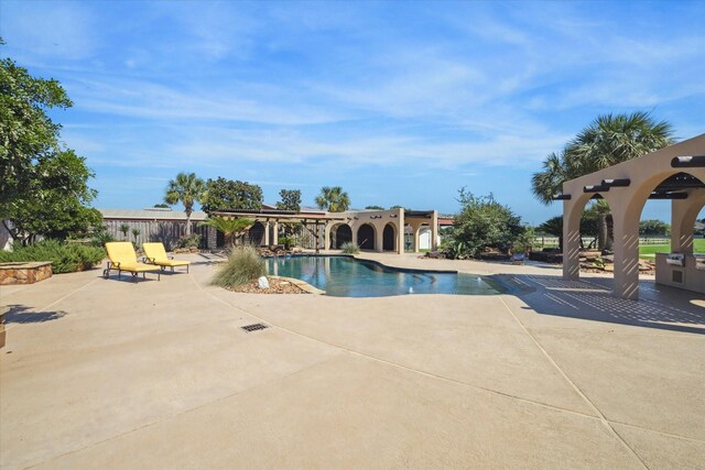 view of pool featuring a patio area