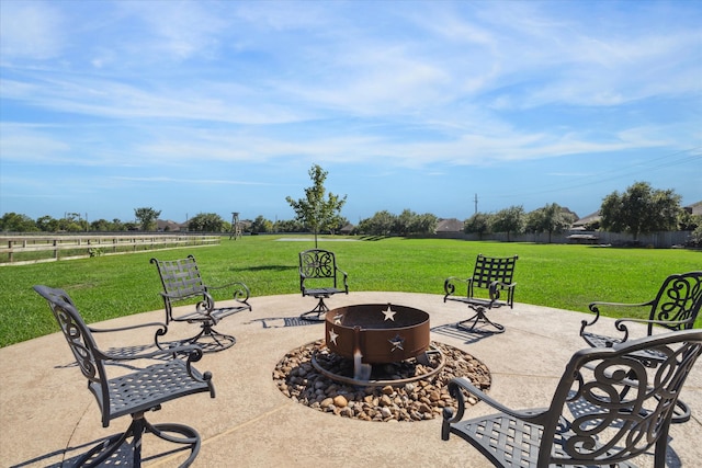 view of patio with an outdoor fire pit