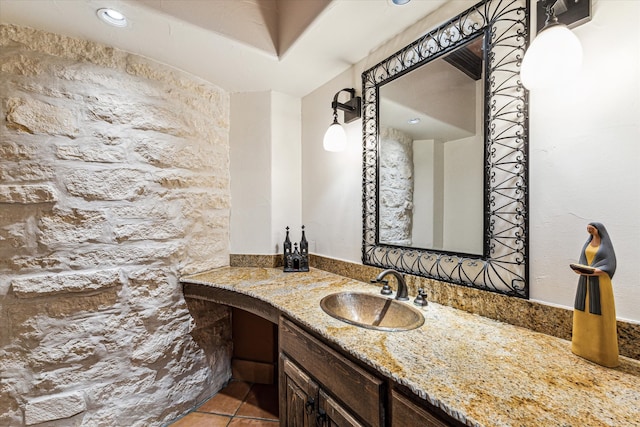 bathroom with tile patterned floors and vanity