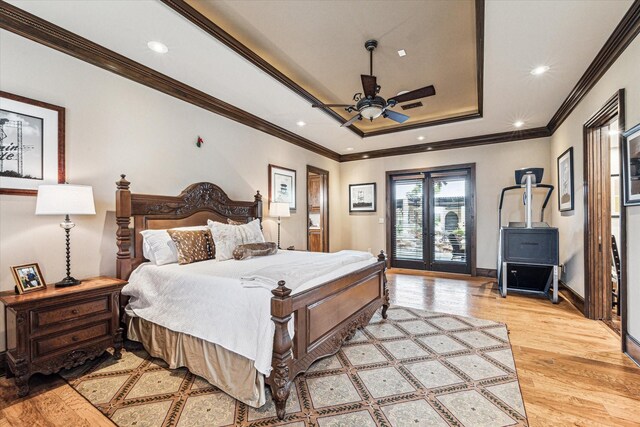 bedroom featuring access to outside, light hardwood / wood-style flooring, ceiling fan, and ornamental molding