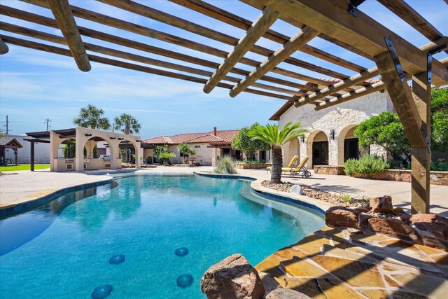 view of swimming pool featuring a pergola and a patio