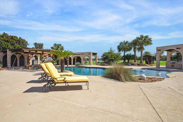 view of swimming pool with a patio area