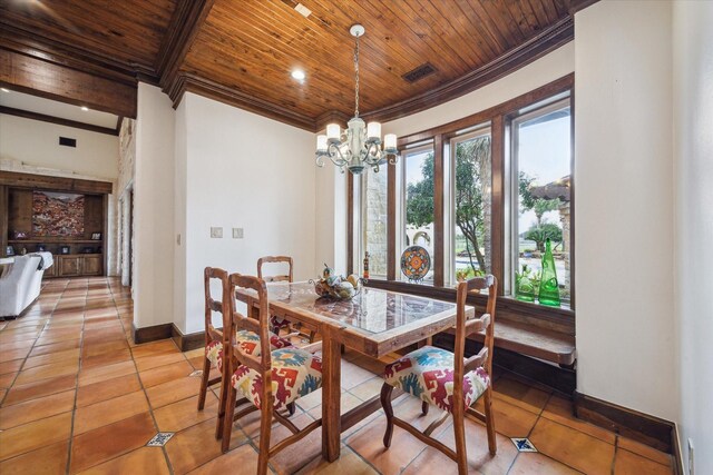 tiled dining space featuring a notable chandelier, wooden ceiling, and crown molding