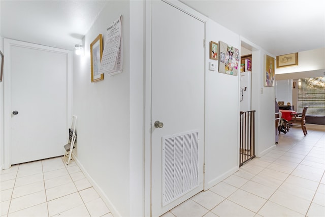 hall with light tile flooring