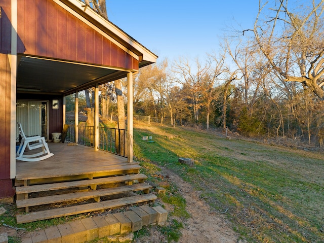 wooden terrace with a yard