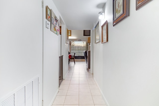 hallway featuring light tile floors