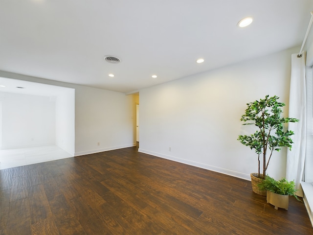 unfurnished room featuring dark hardwood / wood-style floors