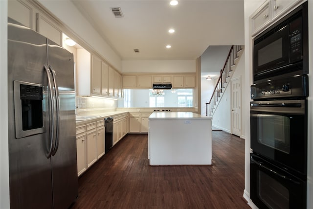 kitchen with ventilation hood, a center island, dark hardwood / wood-style floors, and black appliances