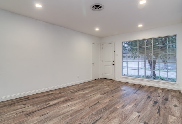 unfurnished room featuring hardwood / wood-style floors