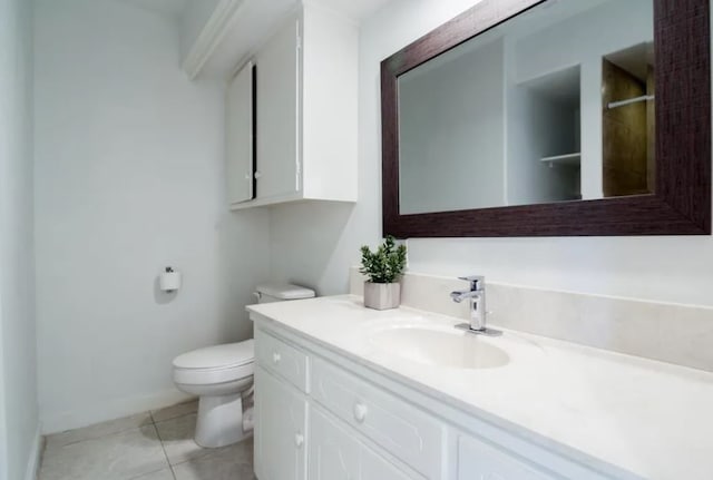 bathroom with tile patterned floors, walk in shower, vanity, and toilet