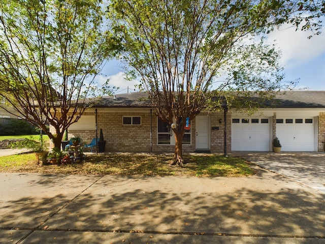 single story home featuring a garage