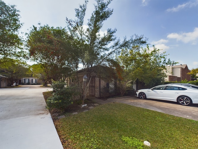 view of side of home featuring a lawn