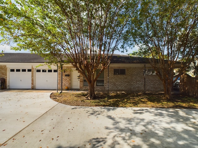 ranch-style home featuring a garage