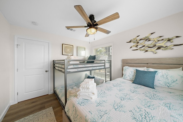 bedroom featuring dark wood-type flooring and ceiling fan