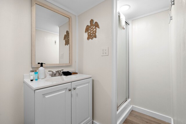 bathroom featuring vanity and hardwood / wood-style floors