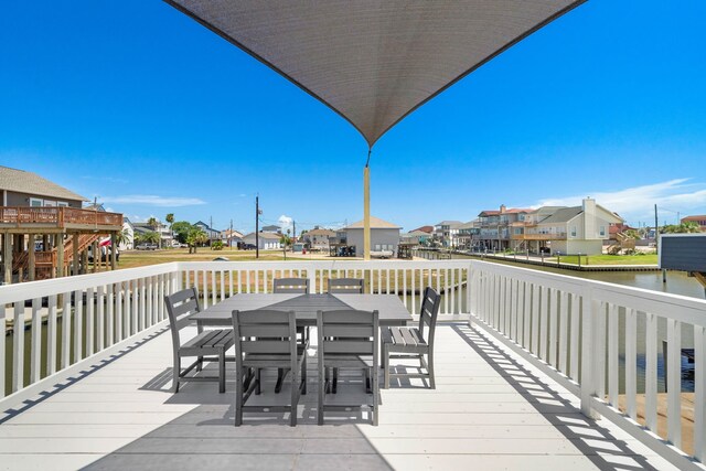 wooden deck featuring a water view