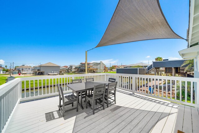 wooden deck featuring a water view