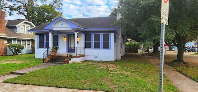 bungalow with a front lawn