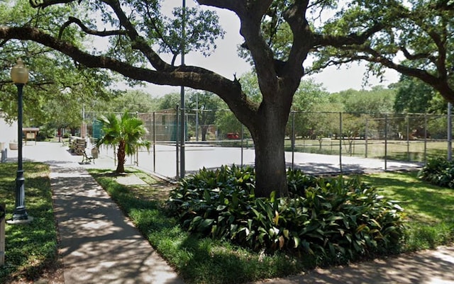 surrounding community featuring tennis court