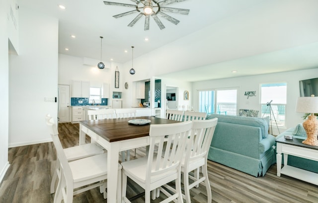 dining area featuring ceiling fan, light hardwood / wood-style floors, and sink