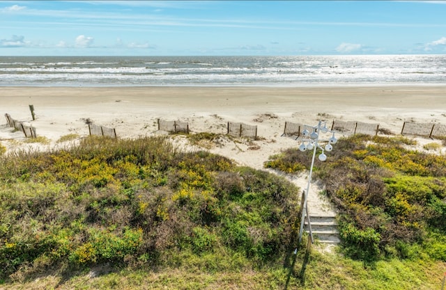 property view of water featuring a beach view