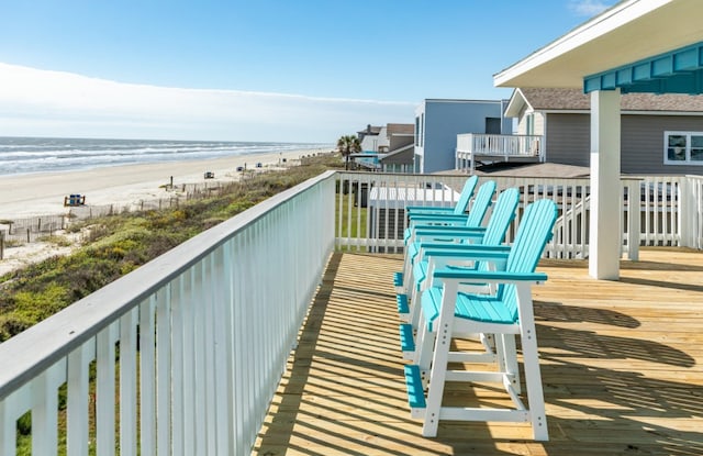 balcony with a beach view and a deck with water view