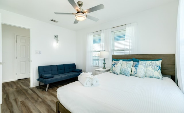 bedroom featuring ceiling fan and dark hardwood / wood-style floors