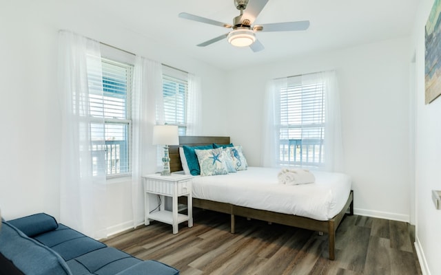 bedroom featuring dark hardwood / wood-style flooring and ceiling fan