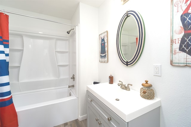 bathroom with vanity, shower / bath combo with shower curtain, and hardwood / wood-style floors