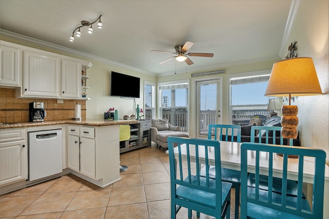 kitchen with white cabinets, backsplash, and white dishwasher