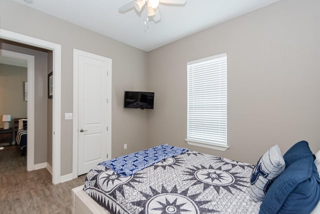 bedroom featuring hardwood / wood-style flooring and ceiling fan