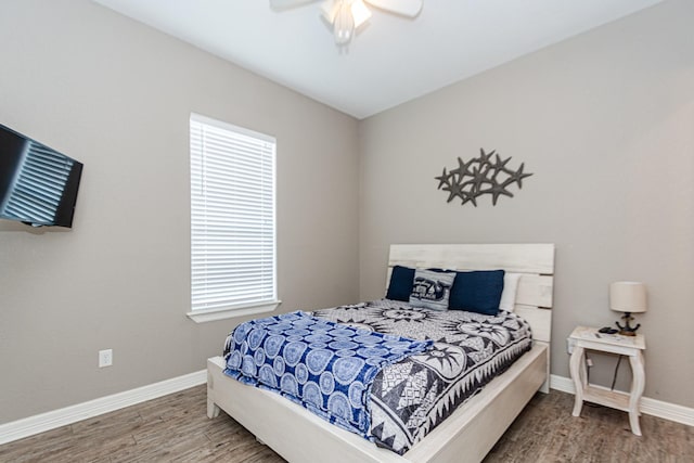 bedroom with hardwood / wood-style flooring and ceiling fan