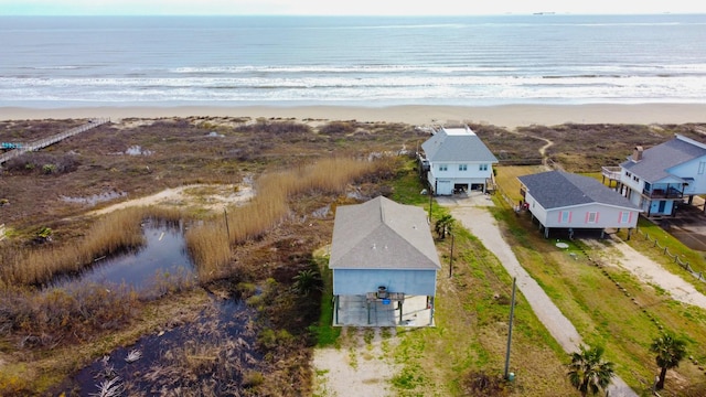 drone / aerial view with a water view and a view of the beach