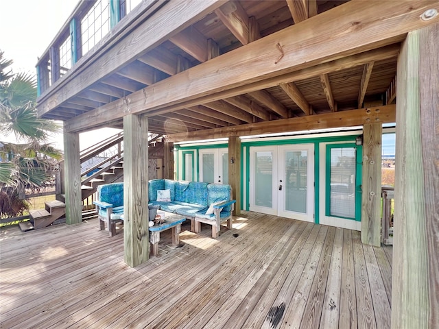 deck featuring outdoor lounge area and french doors