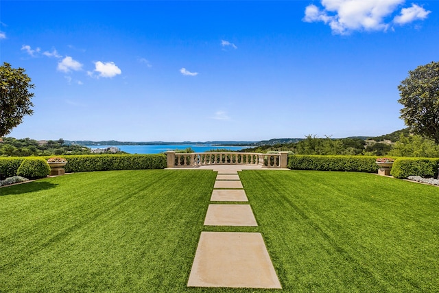 view of nearby features featuring a water view and a yard